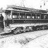 This open-end car and engineer pose in front of the Forest Hills carhouse (which would later become the Jamaica Loop) about 1896. By 1905, all cars were enclosed. An enlargement showing a better view of the conductor is shown on the next page.