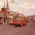 Trolley # 3328 travels down Centre Street at Seaverns Ave. on the way to the Arborway in this 1971 photo. Al's Barber Shop, Congress Cleaners, Jamaica Fruit Center, and Piece O' Pizza were all thriving businesses at the time. Piece O' Pizza went on to become Papa Gino's, and was still owned by Mike Valerio the original owner of the Centre Street restaurant. The Congregational Church steeple can be seen at the corner of Myrtle Street along with the Fire House tower.