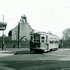 <p>Car number 5690 makes the turnaround at Hyde Square in April of 1949. On the left can be seen a drugstore with a “Drink Coca-Cola” sign. Also on the left a sign reads “Watch Repair”. The “Centre St.” sign can also be seen clearly on the left.</p><br/><p>A chapel can be seen behind the brick wall.  Three school buildings operated by the House of Angel Guardians were also on the grounds. Photograph courtesy of <span>Frank Cheney.</span></p><br/><p>For maps and further history, see these two links:</p><br/><p><a class="offsite-link-inline" href="http://rememberjamaicaplain.blogspot.com/2007/12/perkins-and-day-streets-incomplete.html" target="_blank">Remember Jamaica Plain?</a></p><br/><p><a class="offsite-link-inline" href="http://milhomme.blogspot.com/2014/05/house-of-angel-guardian-jamaica-plain.html" target="_blank">Bill Milhomme Blog</a></p><br/>