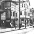 A streetcar travels north on Centre Street in 1912. On the right is the tower of the Burrough's Building. This view is an enlargement of a portion of another photograph appearing here. Note the Mr. Fowler Real Estate sign on the left. Mr. Fowler remains in business but has moved to the other side of the street. A Store 24 currently occupies this Mr. Fowler location at 684 Centre St. Beyond Mr. Fowler is the current location of the Citizen's Bank, Yumont True Value, and CVS Pharmacy. Photograph from the Jamaica Plain Historical Society archives.