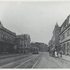<p><span>A streetcar travels north on Centre Street in 1912. On the right is the tower of the Burrough’s Building. The two men on the right are walking towards Keazer’s Fruit Store. On the left is White’s Block. Note the Mr. Fowler Real Estate sign on the left. Photograph from the Jamaica Plain Historical Society archives. Scanned file provided courtesy of City of Boston Archives.</span></p><br/>
