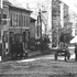 A 1906 view looking down Green St. towards Amory St. Washington St. crosses in the foreground. Current addresses shown in this view run from 171 to 209 Green St. Businesses currently occupying this block include the Somali Development Centre, Union Green Realty, a laundry, a church, a beauty shop, and apartments. Note the horse-drawn wagon on the right and the early motorcar on the left. Trolley tracks can be seen in the foreground running down Washington St. The Elevated Railway (the old Orange line) was being built over Washington St. at this time.