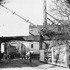 By 1906, the Elevated Railway (the old Orange line) had reached Green and Washington Streets. It was later extended to Forest Hills. The Elevated Railway was demolished in 1987 and replaced by the new Orange line. Two enlargments from this photograph appear on the thumbnails page to the left of the thumbail of this image. Photograph courtesy of David Rooney.