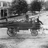 This hook and ladder wagon was photographed in 1885 at the corner of Centre and Burroughs Streets. John Lynch is the driver of Ladder 10. Mark Davis is the call captain standing at the center of the truck. The Seaverns House is visible to the left.