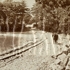 <p>View of Jamaica Pond showing railroad tracks presumably used to transport ice from the pond and from ice warehouses on the shores of the pond to the roadway shown in the distance. <br /><br />Photograph copyright © <span>Frederick Law Olmsted National Historic Site.  All Rights Reserved.  Used with permission. </span> </p><br/>