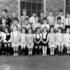 <p>Second grade class of Miss Margaret McHugh at the Mary E. Curley Primary School in 1946.  Photograph provided courtesy of Paul B. Gill, Jr.  A high resolution .tif file of this photo can be <a href="/storage/gallery-full-resolution/second-grade-nov-1946.tif">downloaded here</a>.</p><br/>