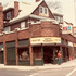 The Smith Pharmacy stands at the corner of Pond St. and Centre St. The storefront on the Pond St. side (#7 Pond) is home to Fire Opal. The corner store houses Cafe Cantata. Smith Pharmacy along with Hailer's and nearly every other family-owned pharmacies were driven out of business by the giant chain pharmacies that dominate the industry today. Storefronts at 603 and 597 Centre St. are also shown. 597 Centre St. was occupied by the Black Bird Cafe, followed by Centre St. Cafe, Perdix, and "10 Tables" which is located there today.
