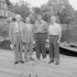 <p>Boston Red Sox Ted Williams (in civvies) flanked by three unknown men in suits on the dock at the boat basin at Jamaica Pond. Courtesy of the Boston Public Library, Leslie Jones Collection. © Leslie Jones. For more information, see: <br/><a href="http://www.flickr.com/photos/boston_public_library/6287037744/in/set-72157627786676056">http://www.flickr.com/photos/boston_public_library/<a><br/>